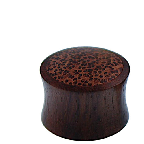 A round, dark brown Holz Plug Kokosholz Inlay handgeschnitzt Sonoholz with a flared shape and textured, dimpled top surface is shown against a white background.