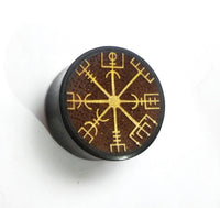 Cargar imagen en el visor de la galería, The Plug Arangholz Wikinger Kompass Inlay double flared is a round, dark wooden plug featuring a yellow-engraved Viking Vegvisir symbol on a brown top, displayed on a plain white surface.
