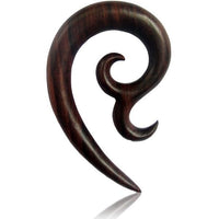 Load image into Gallery viewer, The Sonoholz Tribal Piercing Holz Bogen Bögen Unisex Expander is a hand-carved, dark wood ear gauge with a smooth, curved hook shape and pointed tip, featuring an organic, tribal-inspired design set against a white background.
