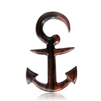 Load image into Gallery viewer, A hand-carved Piercing Anker Narraholz Plug Ohrstecker Expander with a polished brown finish and anchor design, large top loop, pointed flukes, and barbed arms, shown on a white background.
