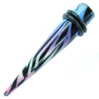 Load image into Gallery viewer, A striking Zebra Piercing Expander Dehnungsstab with rainbow blue, purple, pink, and black stripes, accented by two black rubber O-rings near the wider end—perfect unisex Ohrschmuck for tunnels or plugs.
