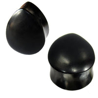Load image into Gallery viewer, Two black, smooth, dome-shaped &quot;Holzplug schwarz Träne&quot; hand-carved ironwood tribal plugs are displayed against a white background.
