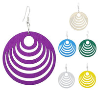 Load image into Gallery viewer, Five round, colorful Holzohrringe (50 mm) with curved cutout patterns in purple, white, blue, green, silver, and yellow are displayed on white. On the left is a large, nickelfree purple earring from the &quot;Holzohrringe bunt 50 mm rund Halbkreise Damen Ohrringe Holz Ohrhänger Organic.

