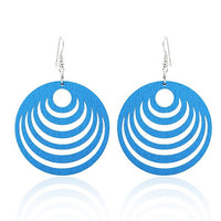 Load image into Gallery viewer, A pair of 50 mm round, colorful Holzohrringe &quot;Halbkreise Damen Ohrringe Holz Ohrhänger Organic&quot; with curved cut-out designs and silver, nickelfrei hooks, displayed on a white background.
