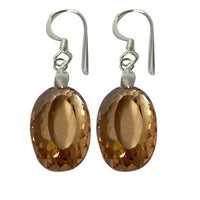 Load image into Gallery viewer, These Silberohrringe Ohrhänger feature oval-facettierten Zirkonia in amber tones, set in 925er Sterlingsilber, displayed against a white background.
