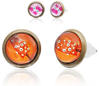 Cargar imagen en el visor de la galería, Two pairs of 12mm round, colorful Brass Ohrstecker earrings are shown: one features a red and orange design with white dots, the other a pink and white cartoon owl, both made of nickelfrei, stainless steel, unisex.
