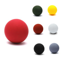 Load image into Gallery viewer, Seven solid-colored rubber-coated 6 mm stainless steel Ohrstecker Kugel Perle earrings in red, green, yellow, brown, white, black, and gray are arranged on a white background, highlighting the playful simplicity of this unisex, nickel-free jewelry.
