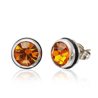 Load image into Gallery viewer, A pair of CHICNET Brass Ohrstecker in silber with 10mm round Glaskristall and rubber, featuring faceted orange gemstones in smooth bezels, displayed on a white background with a subtle reflection below.

