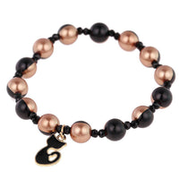 Load image into Gallery viewer, Armband Brass golden schwarz halb Perlen Kristalle Katze Charm verstellbar - chic-net.de
