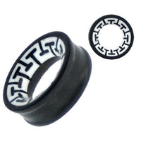 Load image into Gallery viewer, The Tribal Holz Tunnel is a black ironwood ring with a hand-carved white bone inlay, featuring a repeating black geometric pattern inspired by tribal designs. Shown from the side and top to highlight its unique motif.
